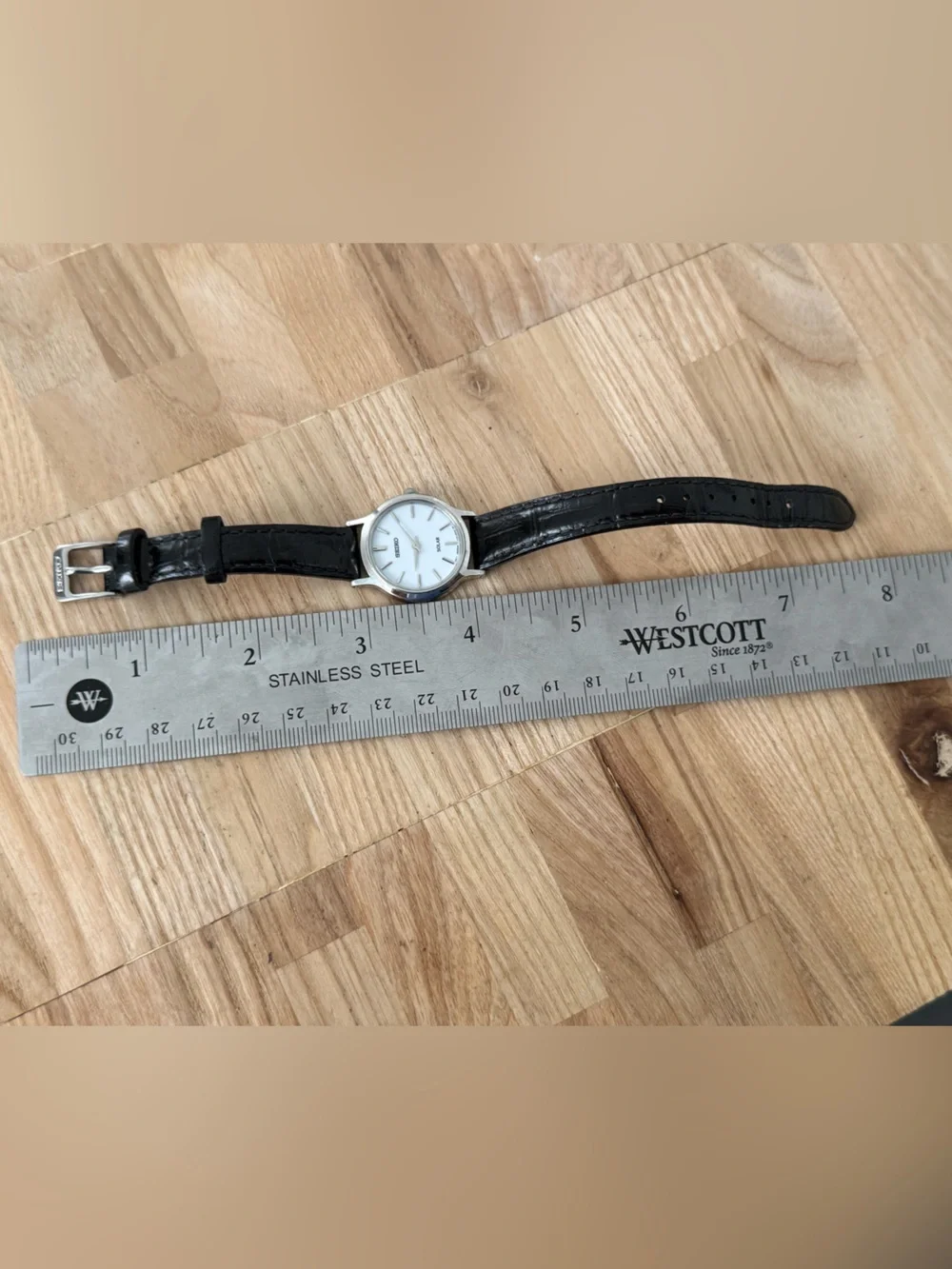 Seiko Solar Ladies Watch White Round Dial Black Leather Strap Stainless Case